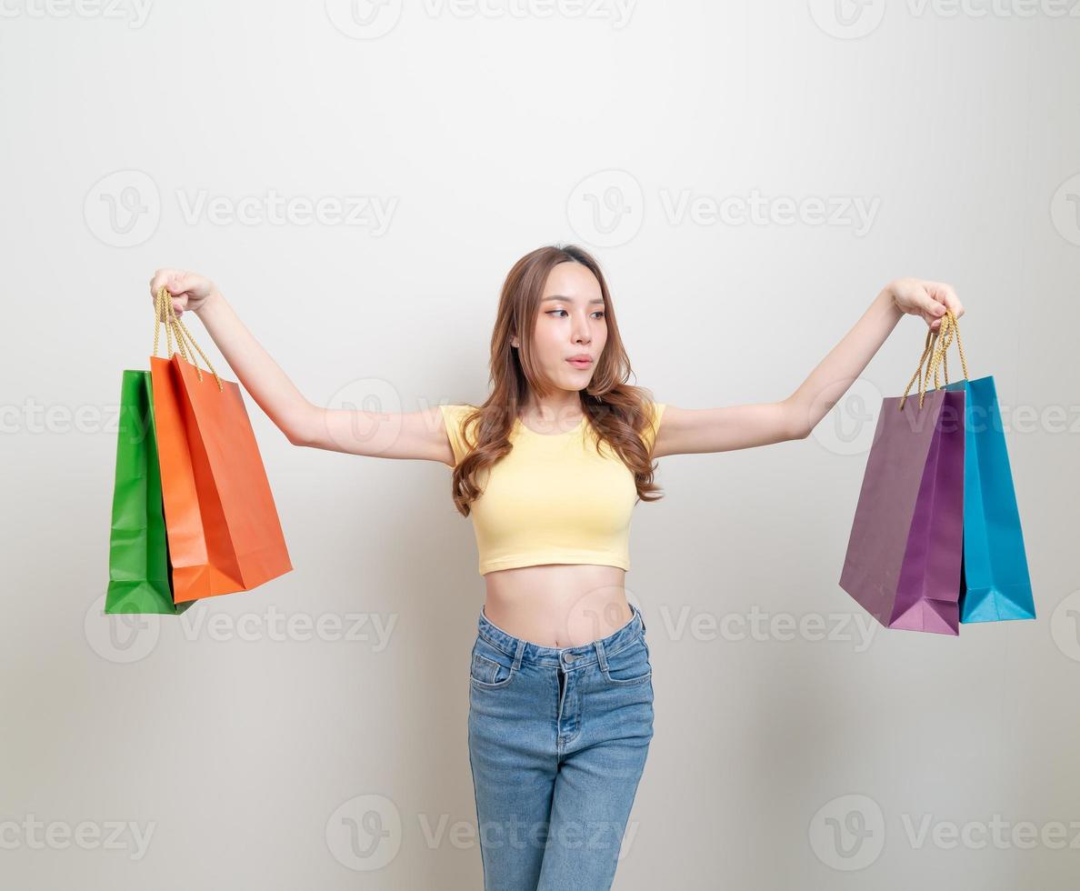 portrait beautiful Asian woman holding shopping bag photo