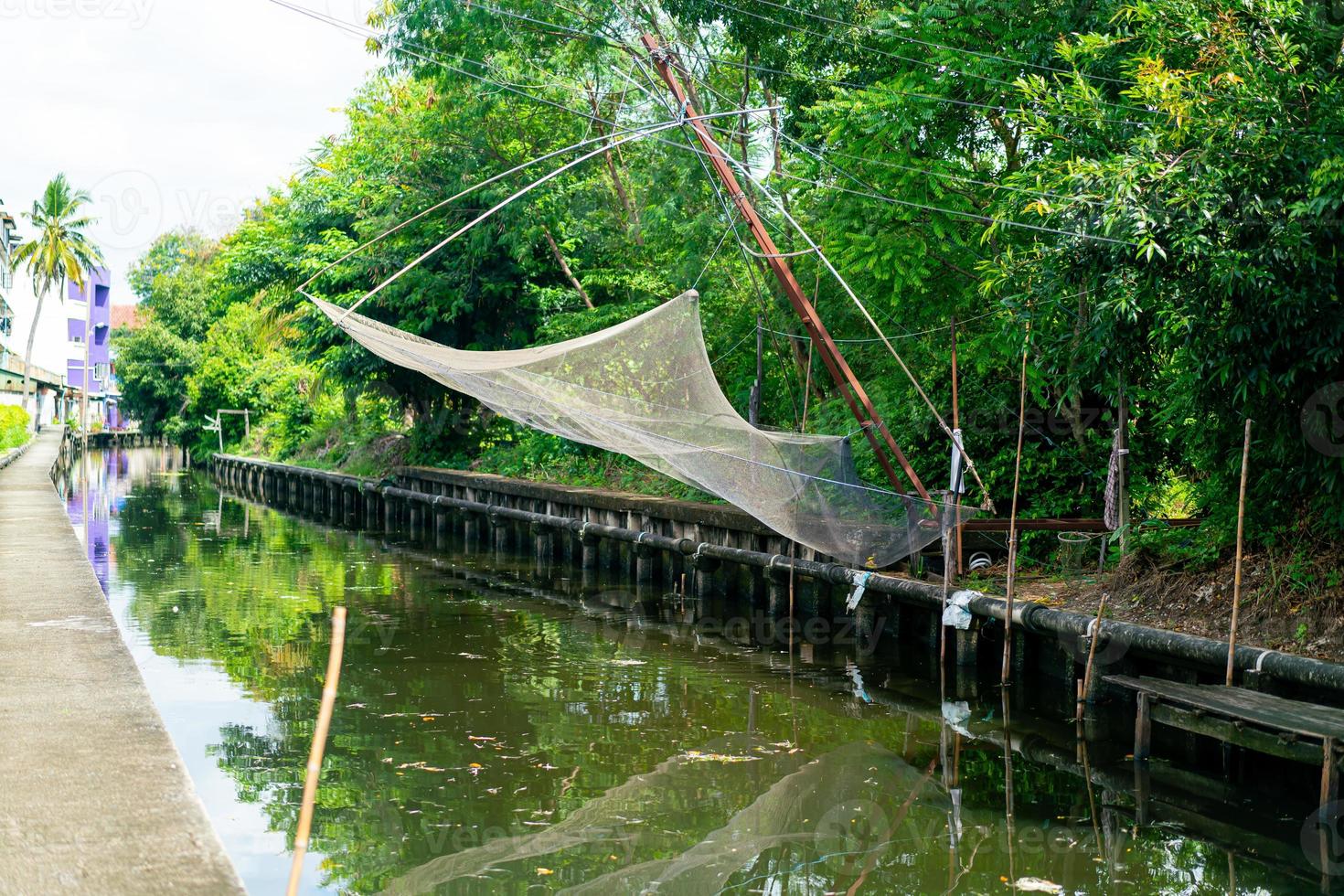 fishing nets hanging on canal photo