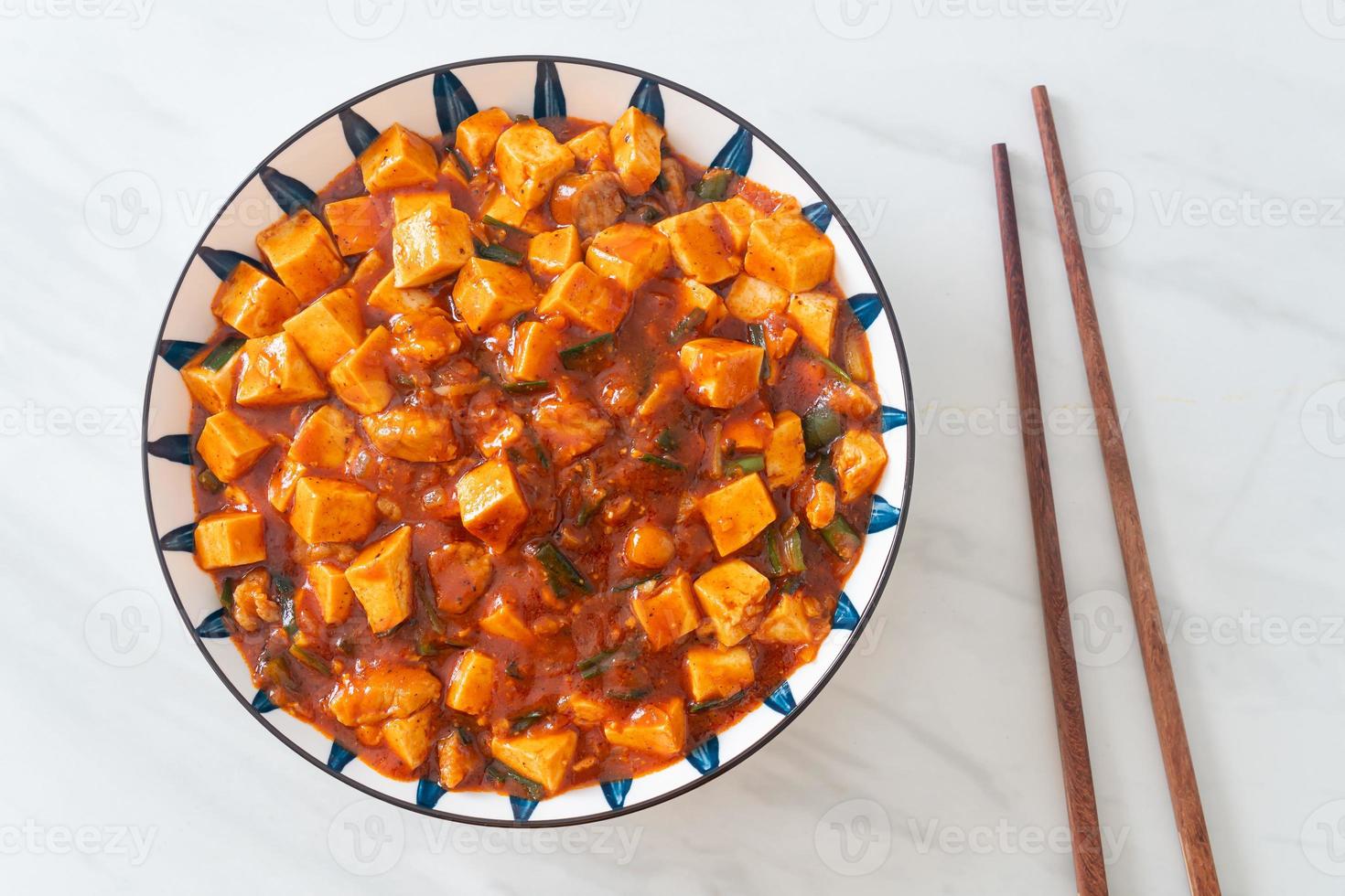 Mapo Tofu - The traditional Sichuan dish of silken tofu and ground beef, packed with mala flavor from chili oil and Sichuan peppercorns. photo