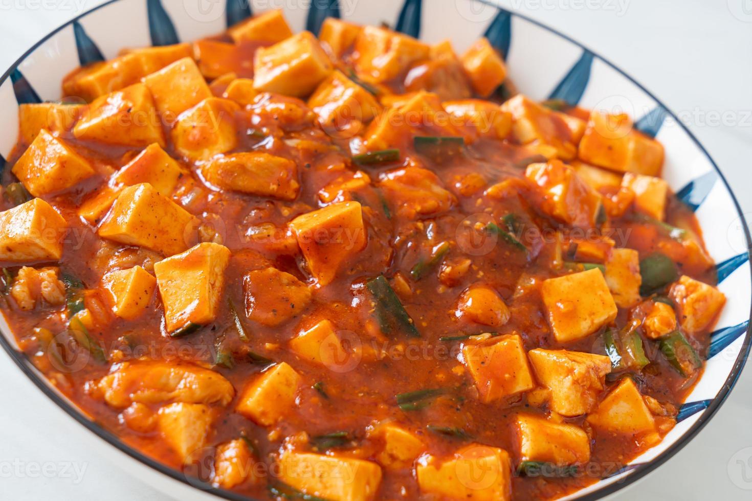 Mapo Tofu - The traditional Sichuan dish of silken tofu and ground beef, packed with mala flavor from chili oil and Sichuan peppercorns. photo