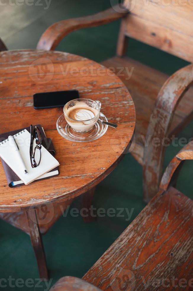 Coffee cup on rustic wood table photo