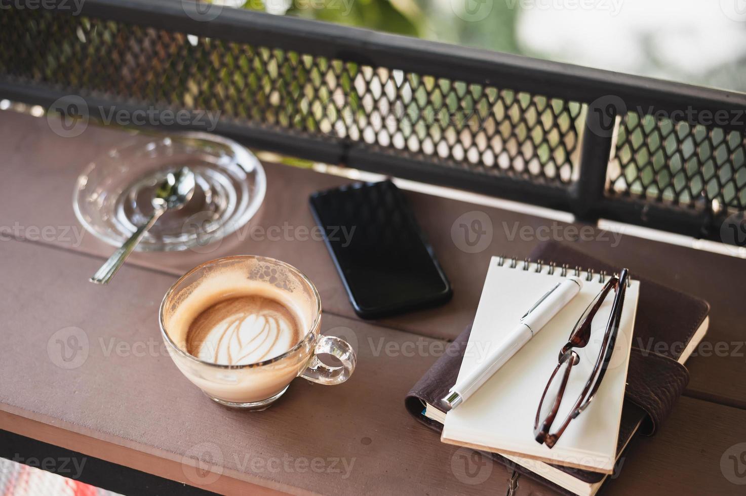 Coffee cup on rustic wood table photo