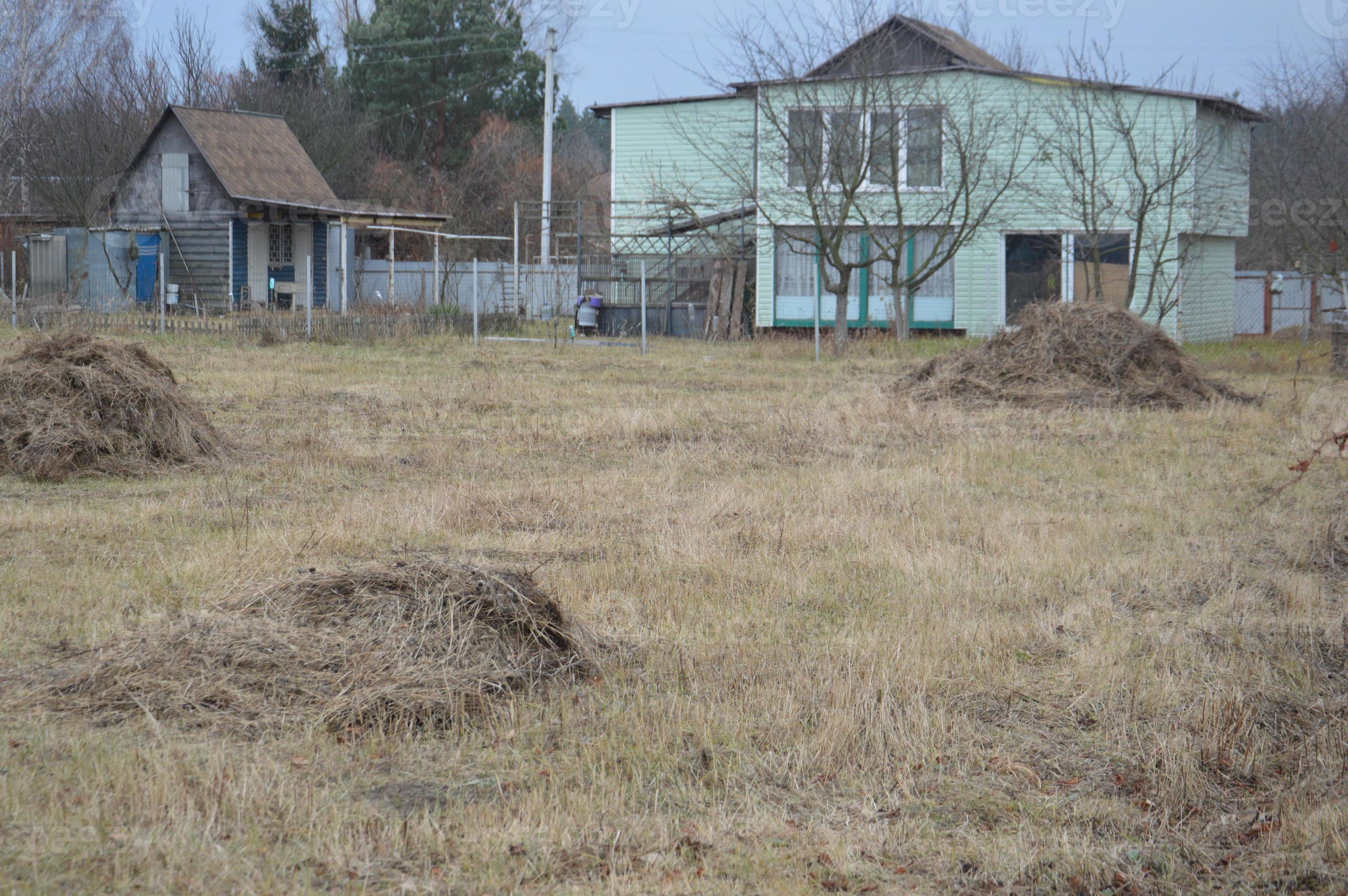 A pile of hay and manure prepared to fertilize the vegetable garden for