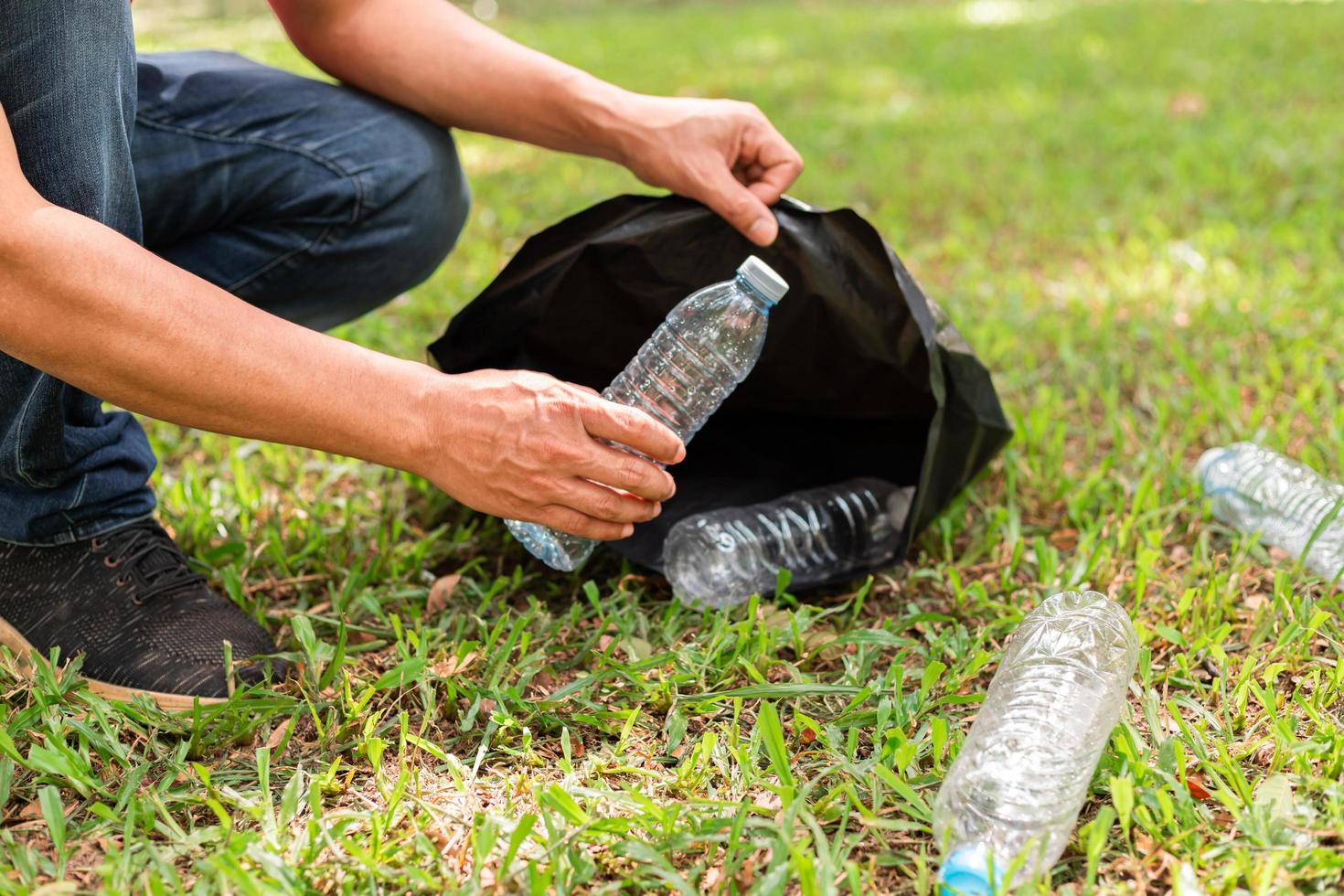 people collecting plastic bottles photo