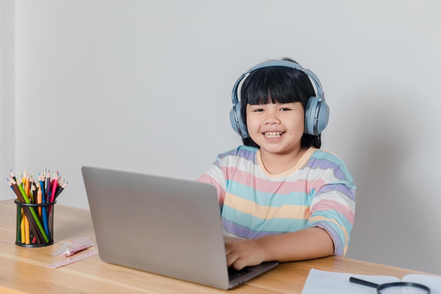 girls studying online at home photo