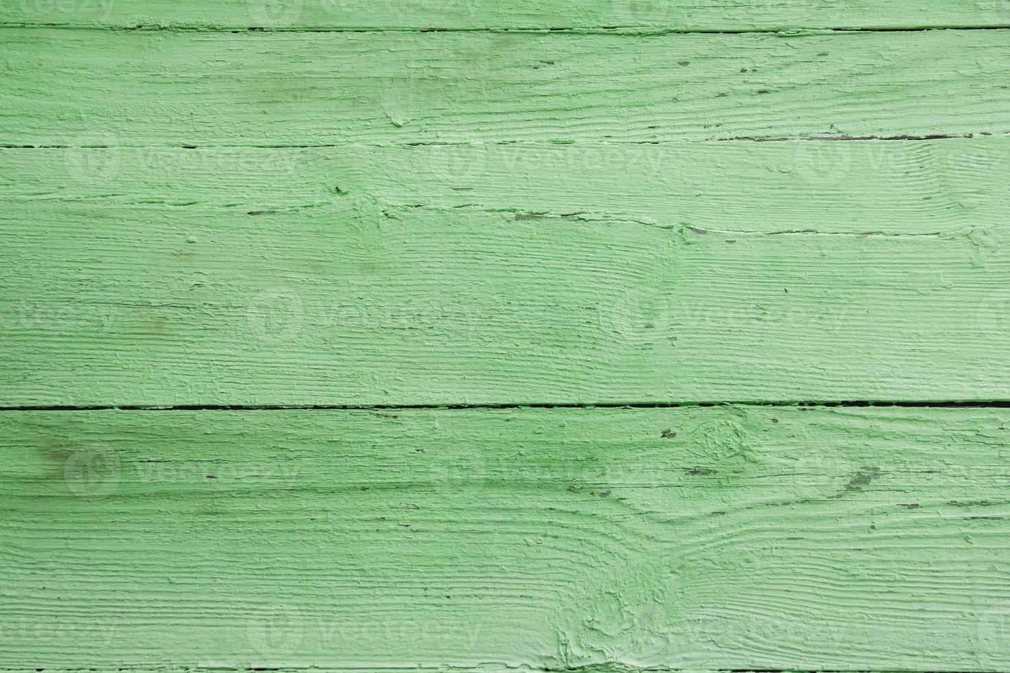 Old grungy wooden planks background in green color. Abstract background and texture for design photo