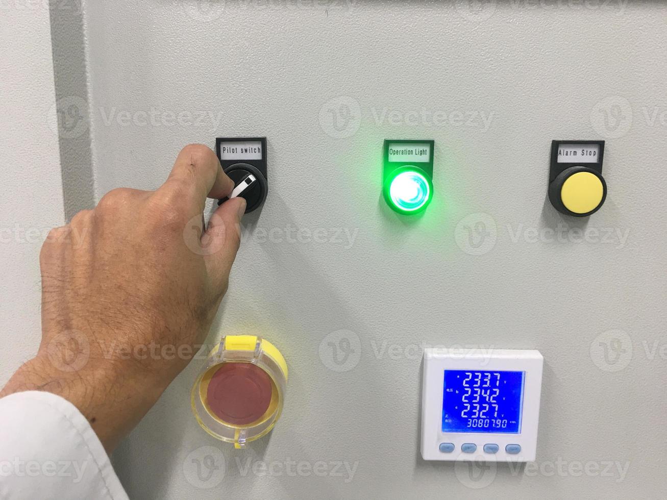 hand touch on button machine in factory industrial photo