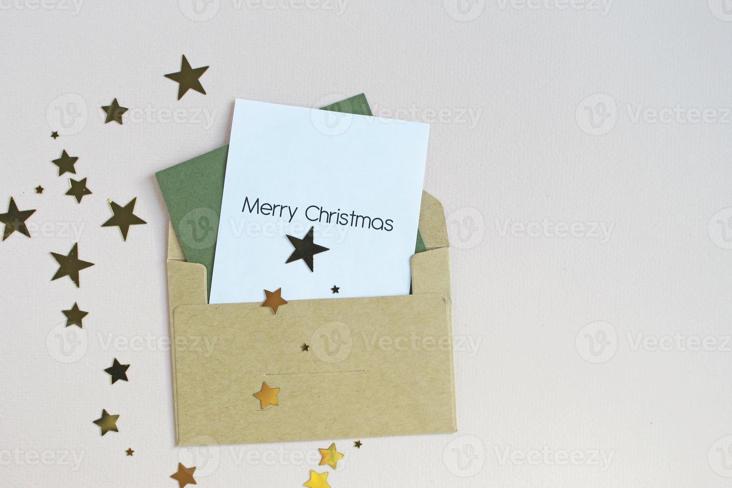 New Year or Christmas top view holiday celebration red envelope letter copy space green color paper background. Template greeting card photo