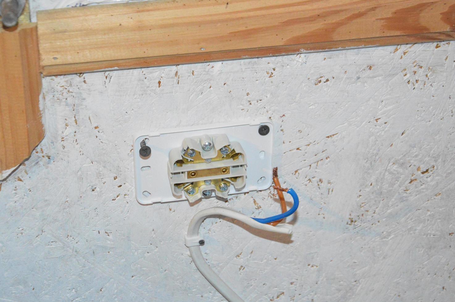 The work of an electrician to conduct electric light in offices and apartments photo