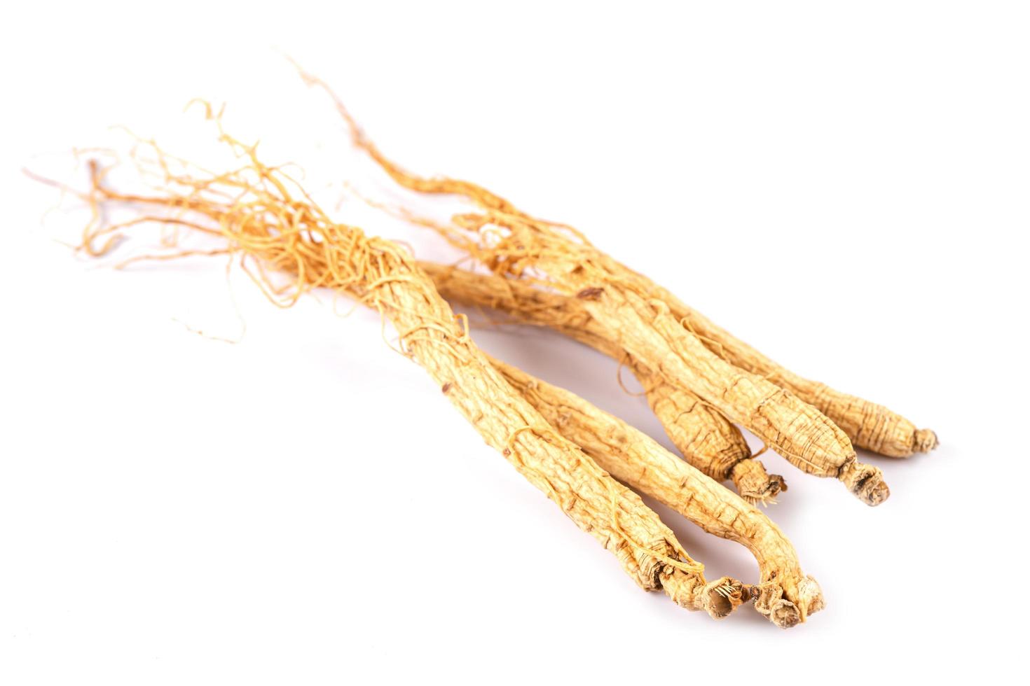 Ginseng, dried vegetable herb. Healthy food famous export food in Korea country isolated on white background. photo