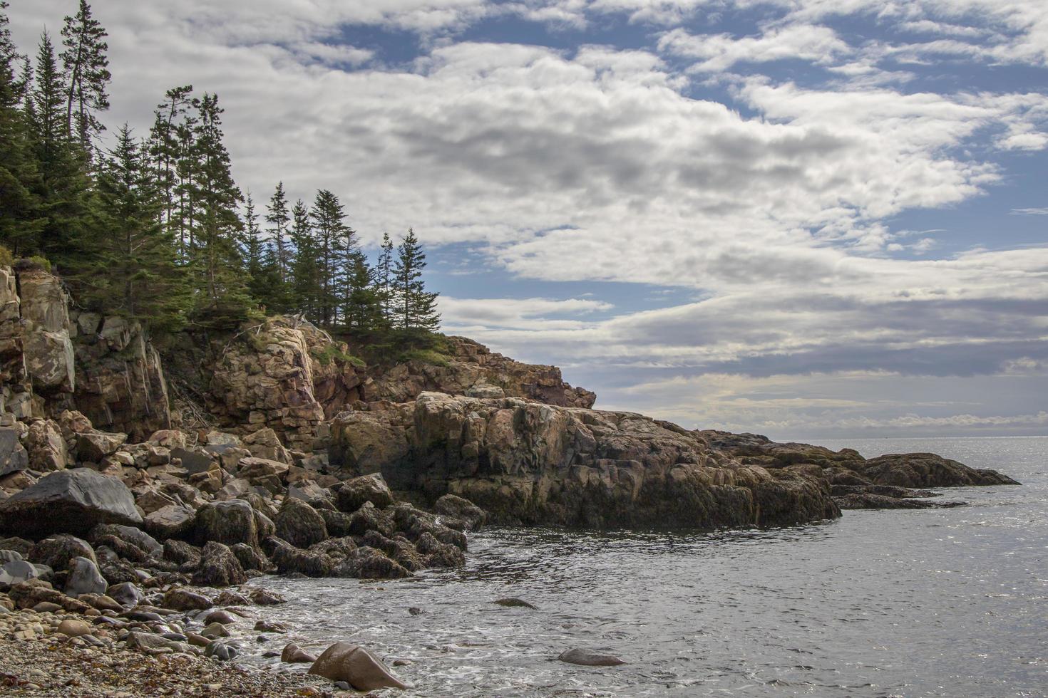 Rocky coastline along the ocean in Maine, United States photo