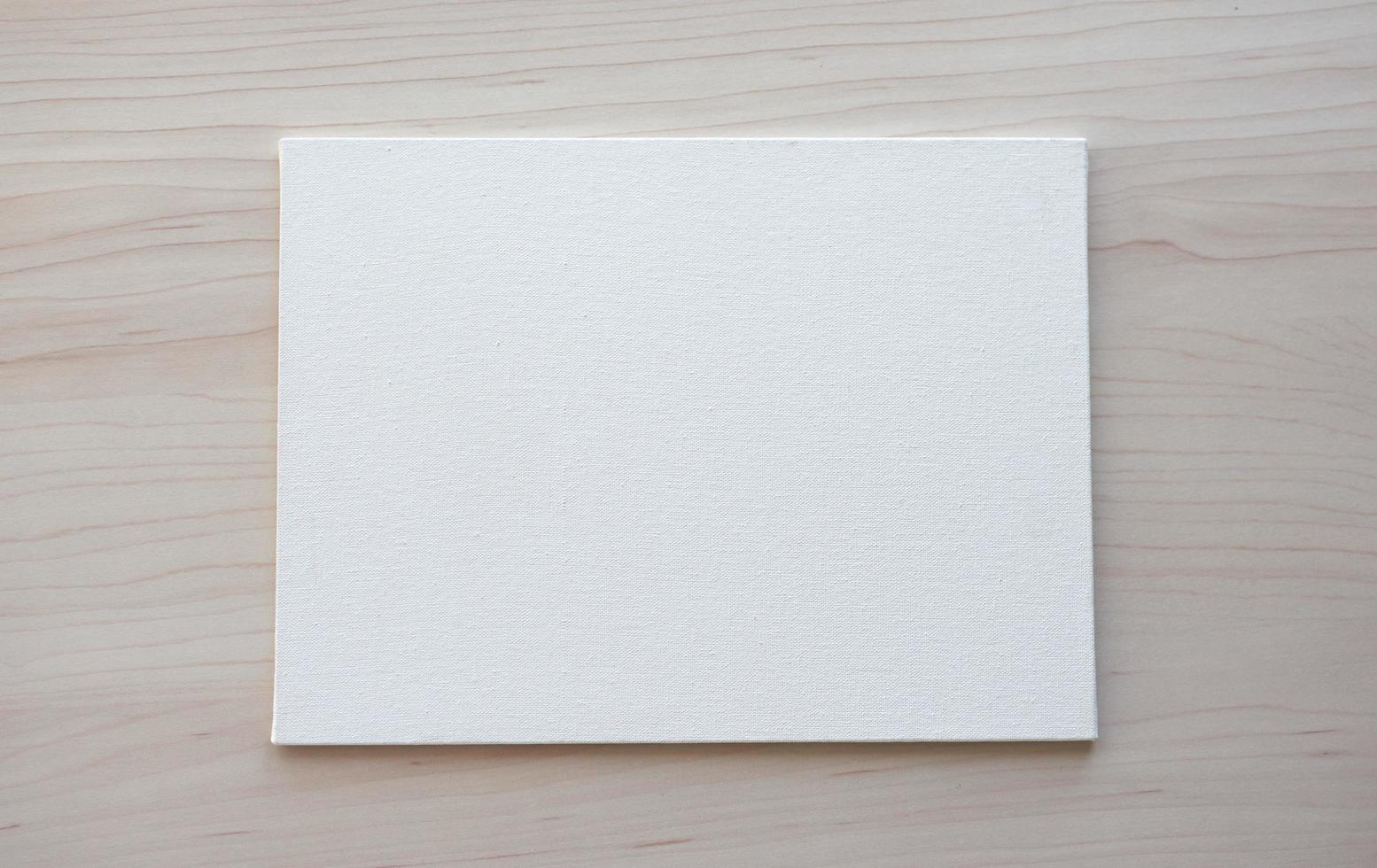 White board with hands for copy space. School office supplies on wooden background. Back to school concept. Top view ready for your design photo