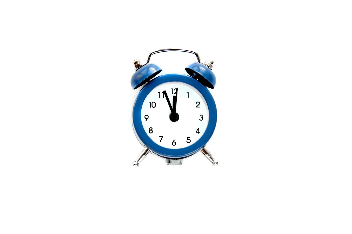 Grey vintage alarm clock shows 12 o'clock isolated on white background. Wake up and hurry up. Hot sale, final price, last chance. Countdown to midnight new year photo