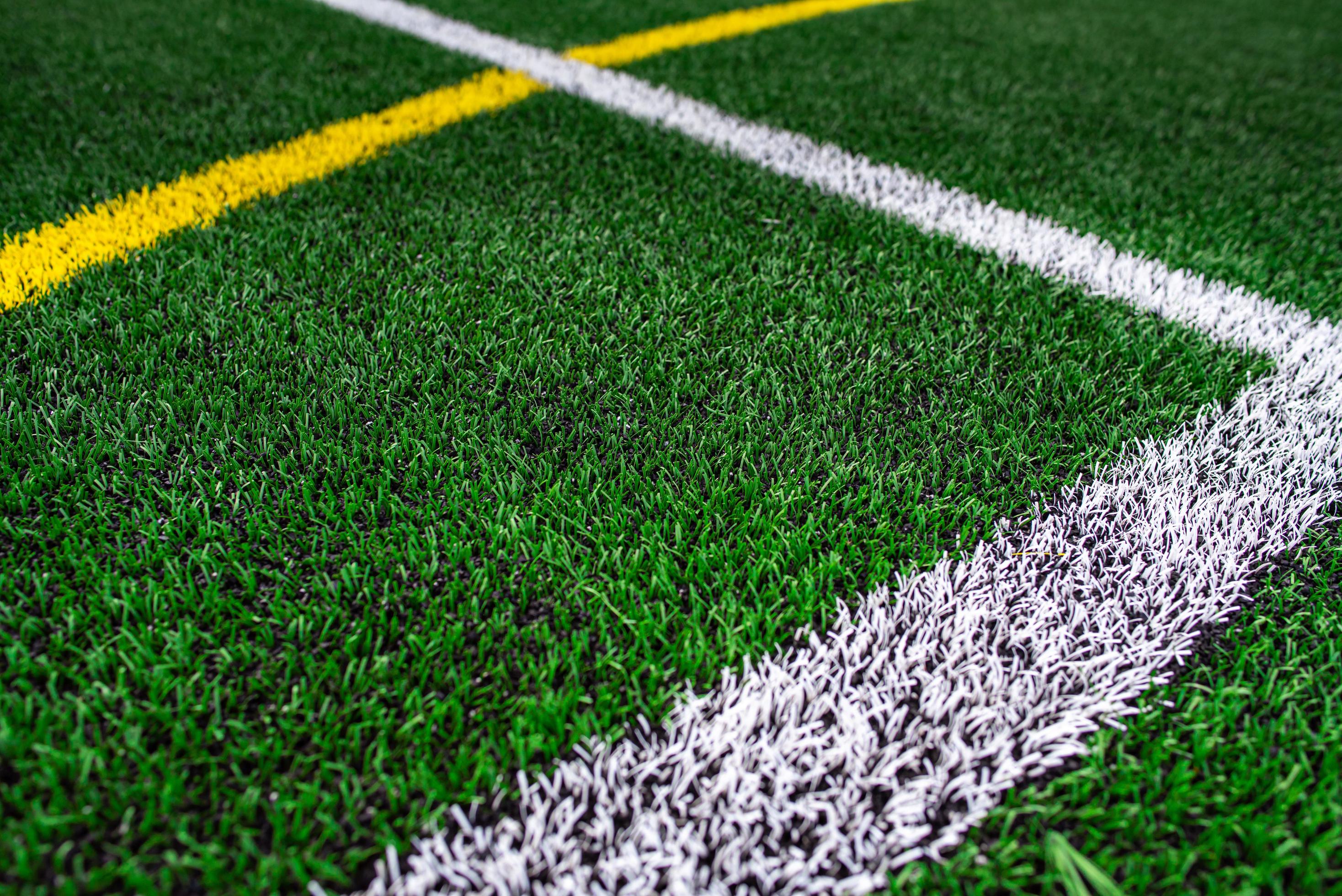 University or School Football field stadium, green grass background