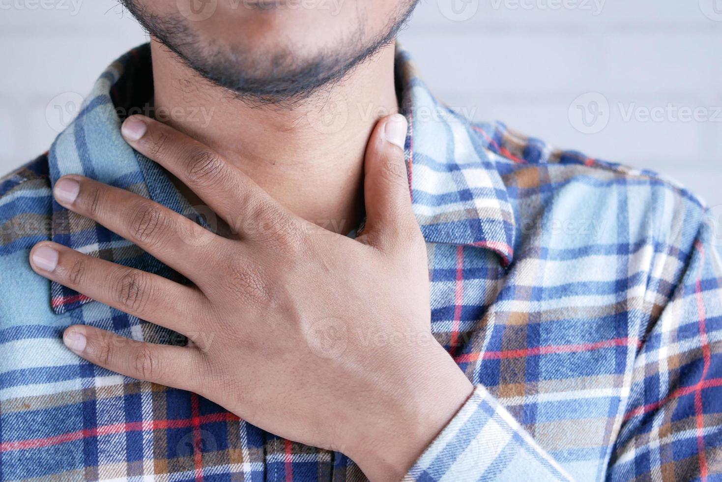 unrecognized man suffering throat pain close up photo