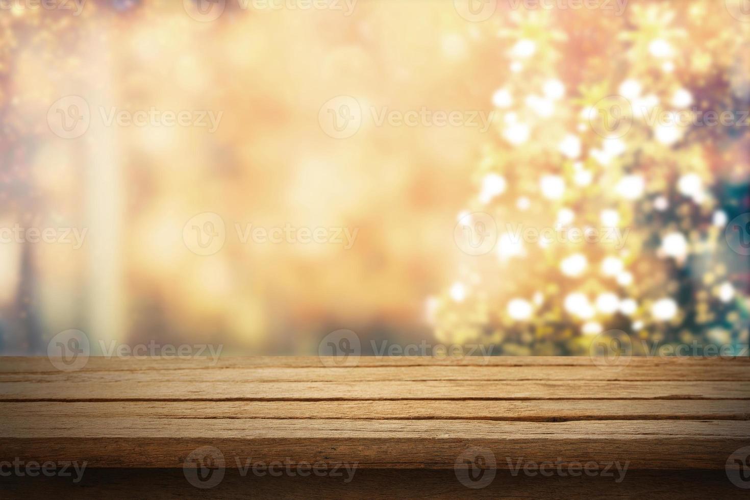 Wooden table with Christmas background photo