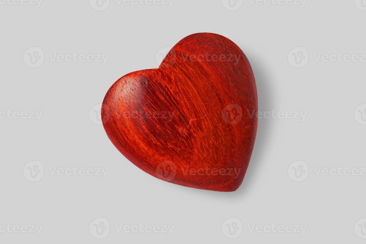 Close up view shiny wooden heart isolated on white background. added copy space for text. photo