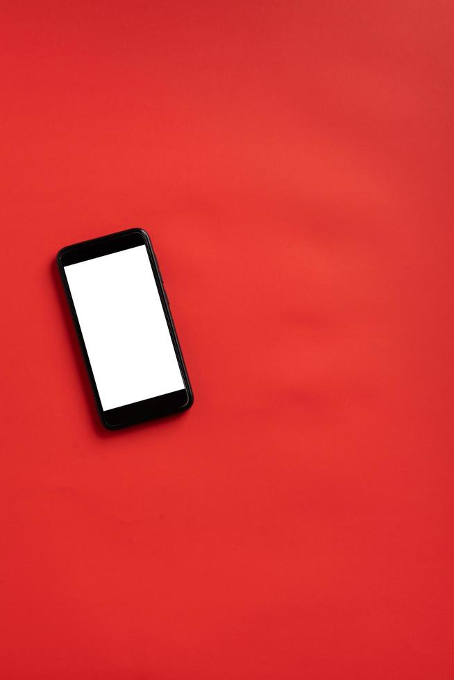 Smart phone on red background photo