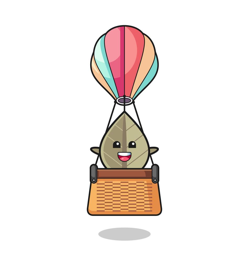 dried leaf mascot riding a hot air balloon vector