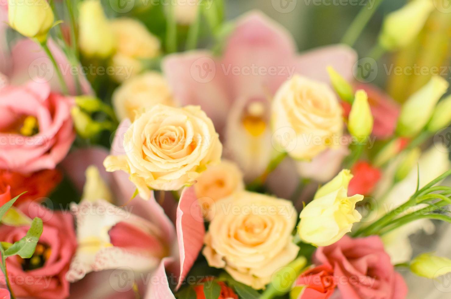 Bouquet with orchids and roses on a beautiful background photo