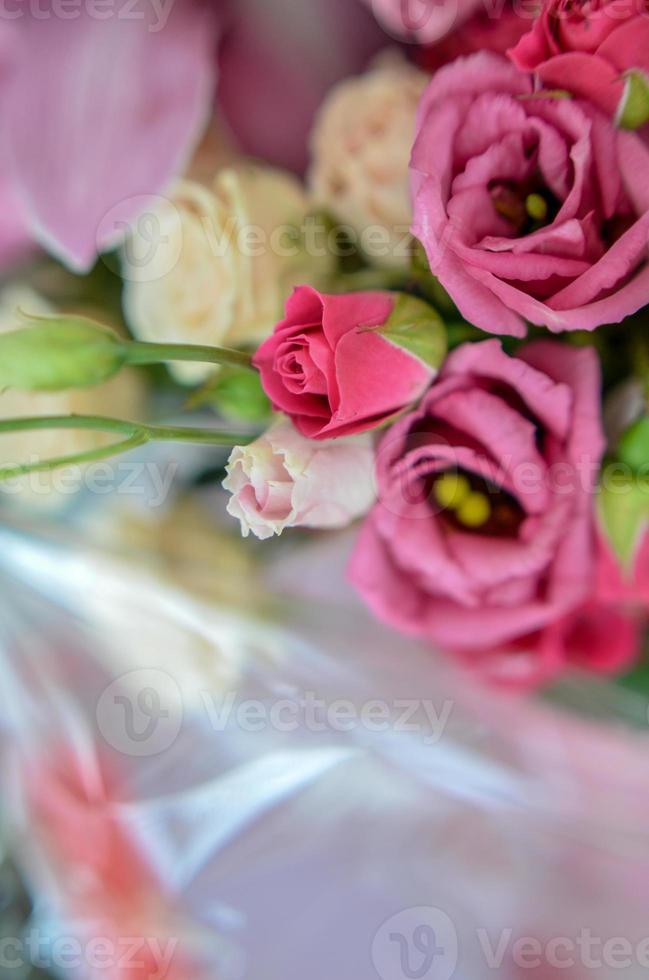 Bouquet with orchids and roses on a beautiful background photo