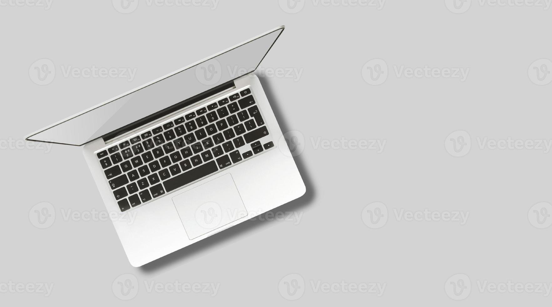 Laptop computer mock up with empty blank white screen isolated on grey background. photo