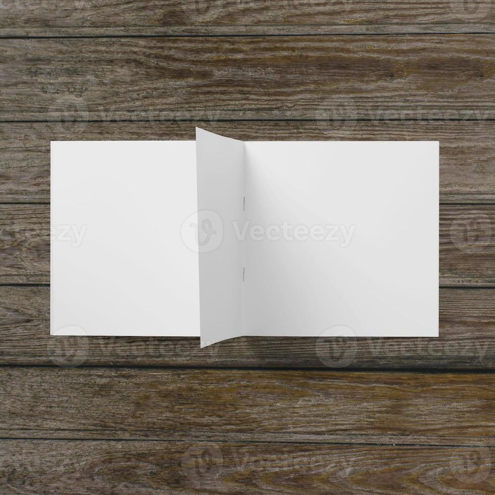 Blank white paper on wooden table. photo