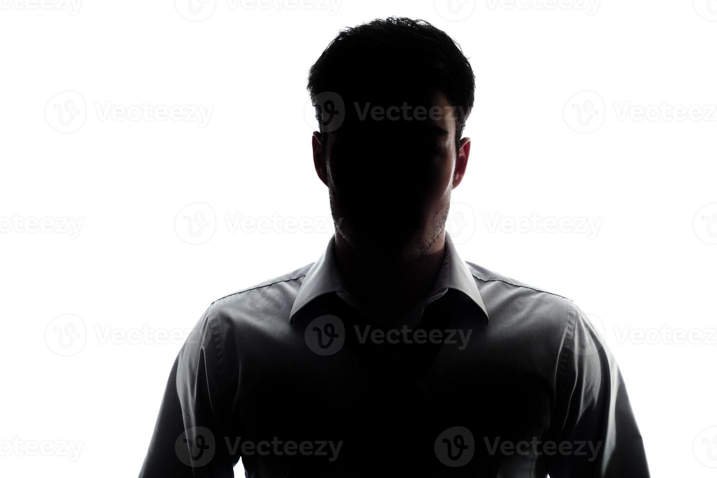 Businessman portrait silhouette wearing a open collar shirt photo
