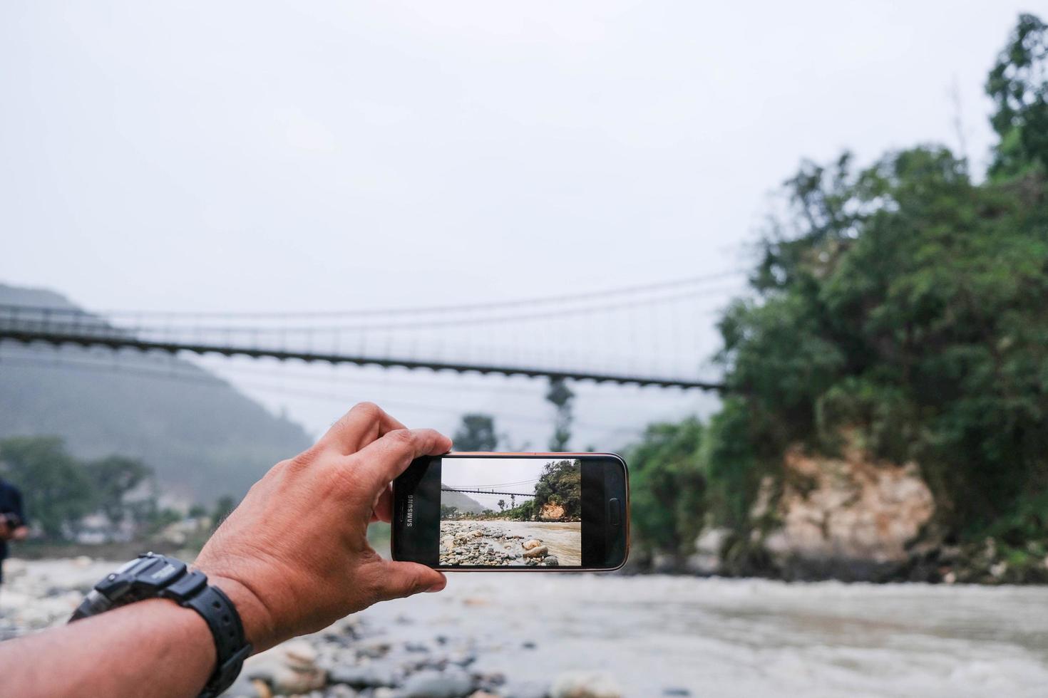 Peaceful village on the banks of river Ganges in the Himalayan Valley photo
