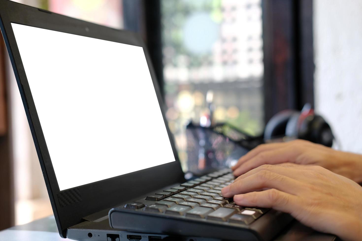 Man working on a laptop at home and Hard at work on reaching success photo