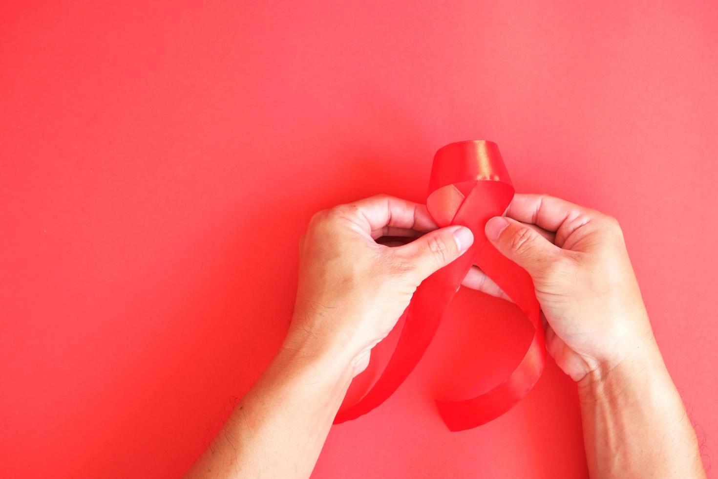 The subject of healthcare with World Cancer Day is a ribbon, which is a worldwide symbol of HIV and AIDS awareness. photo