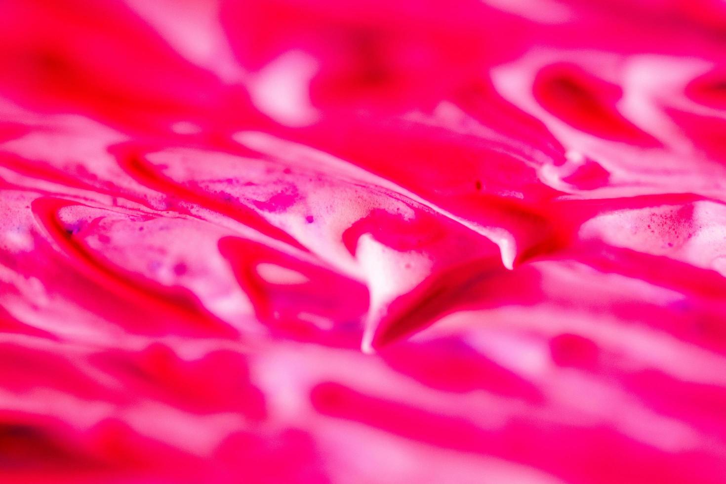 abstract light red beautiful liquid marble fluid acrylic paint vibrant texture. photo