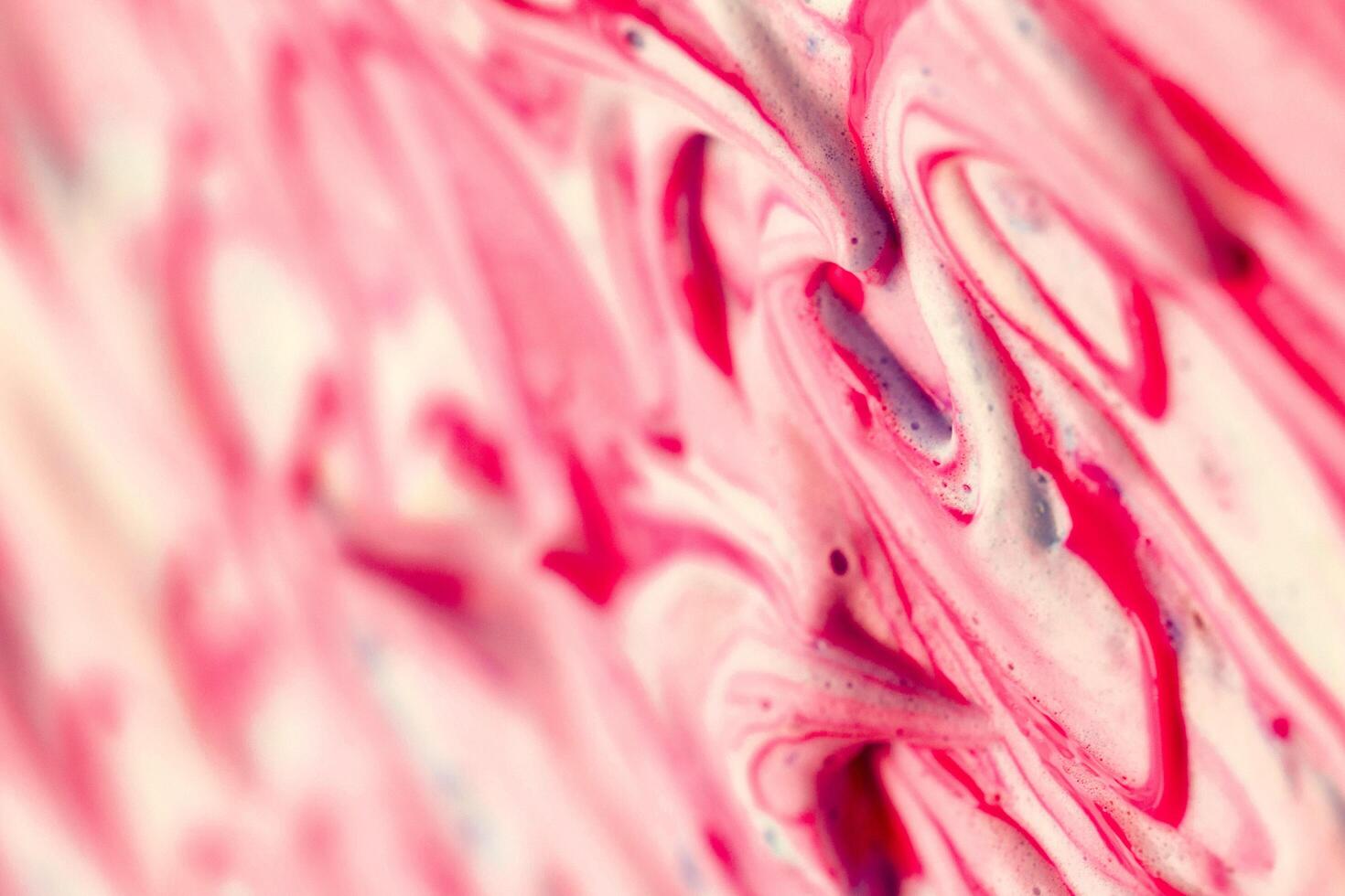 abstract light red beautiful liquid marble fluid acrylic paint vibrant texture. photo