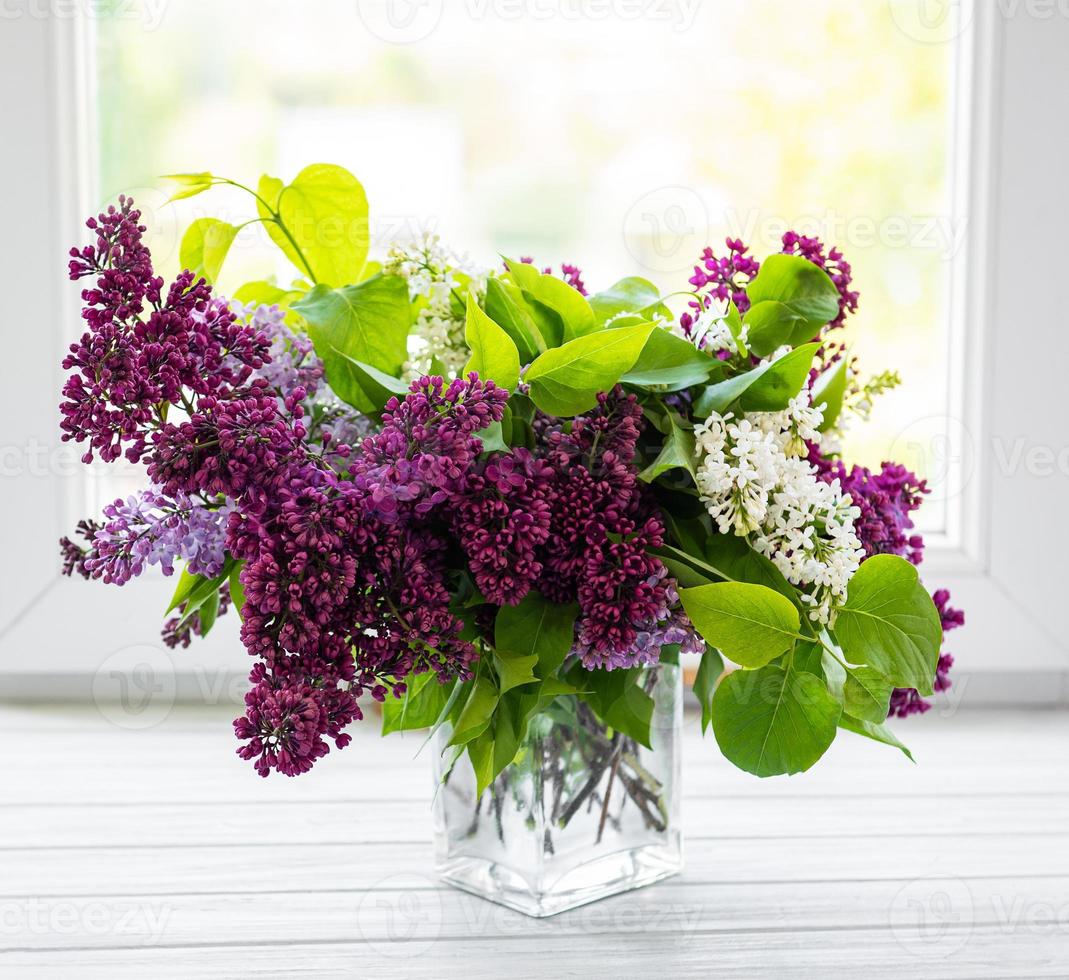 Bunch lilac in vase photo