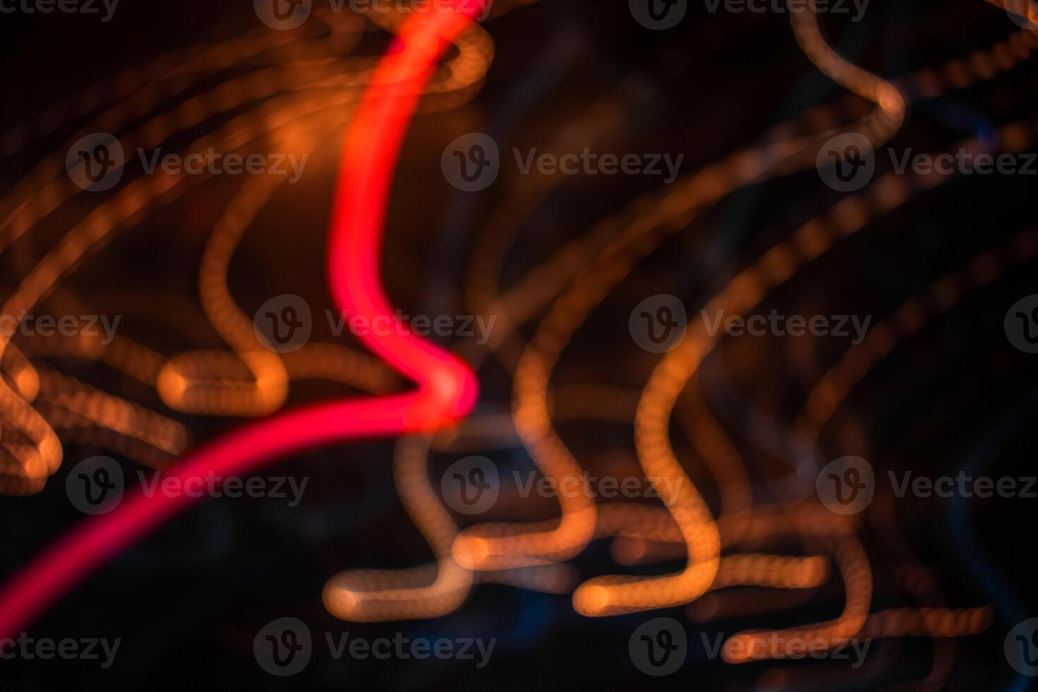 light orange trail blur summer abstract lights at motion swirl trail effect black photo