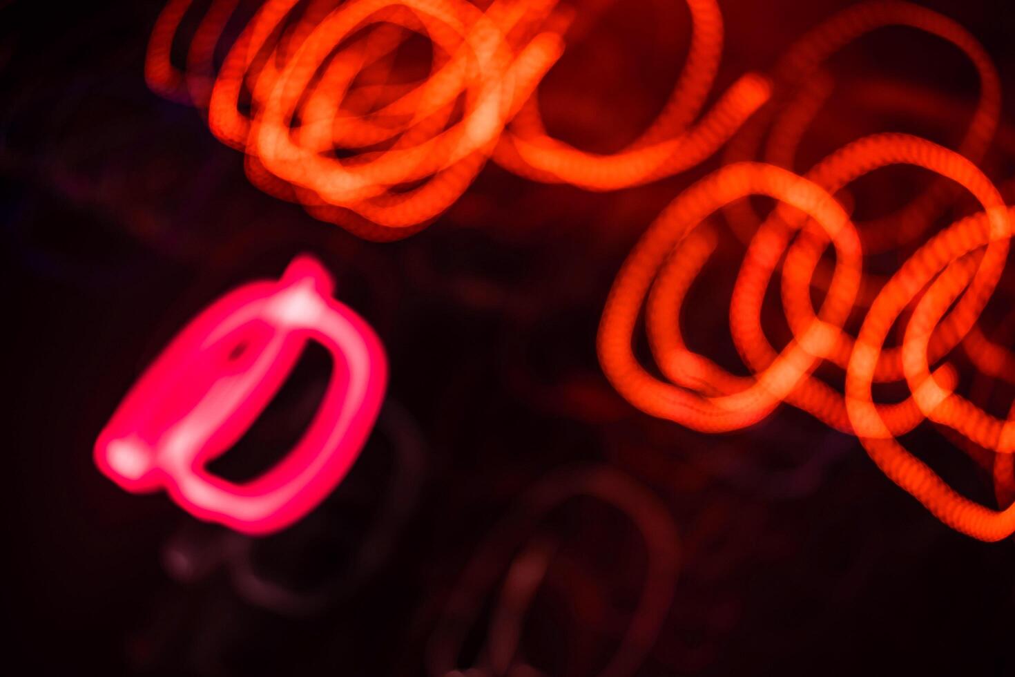 light orange and pink light trail blur abstract lights at motion exposure time swirl trail effect photo