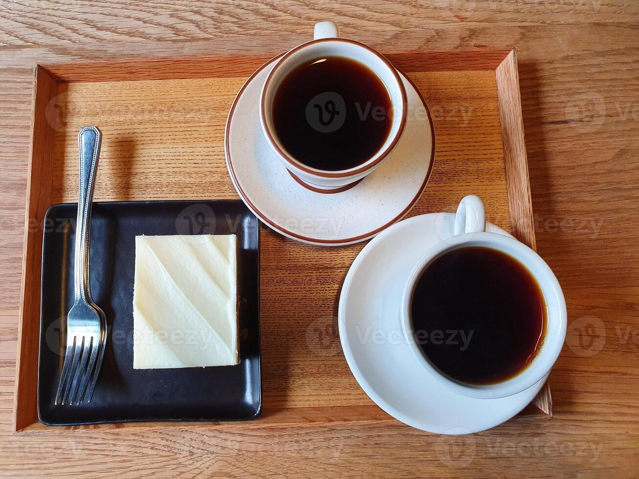 two black coffees in a white cup photo