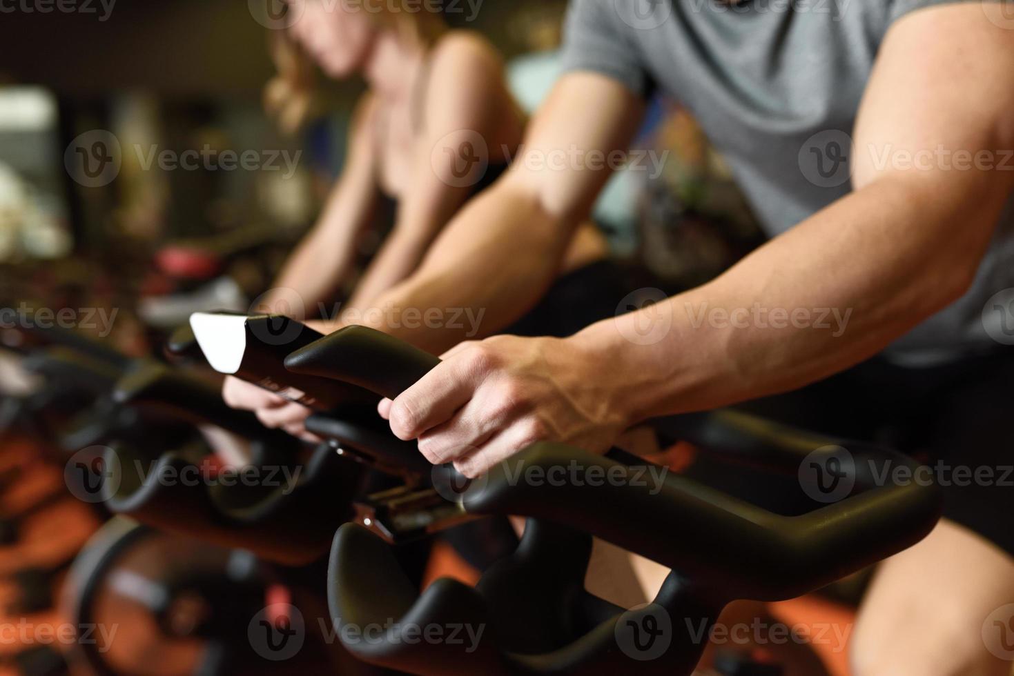 Couple in a spinning class wearing sportswear. photo