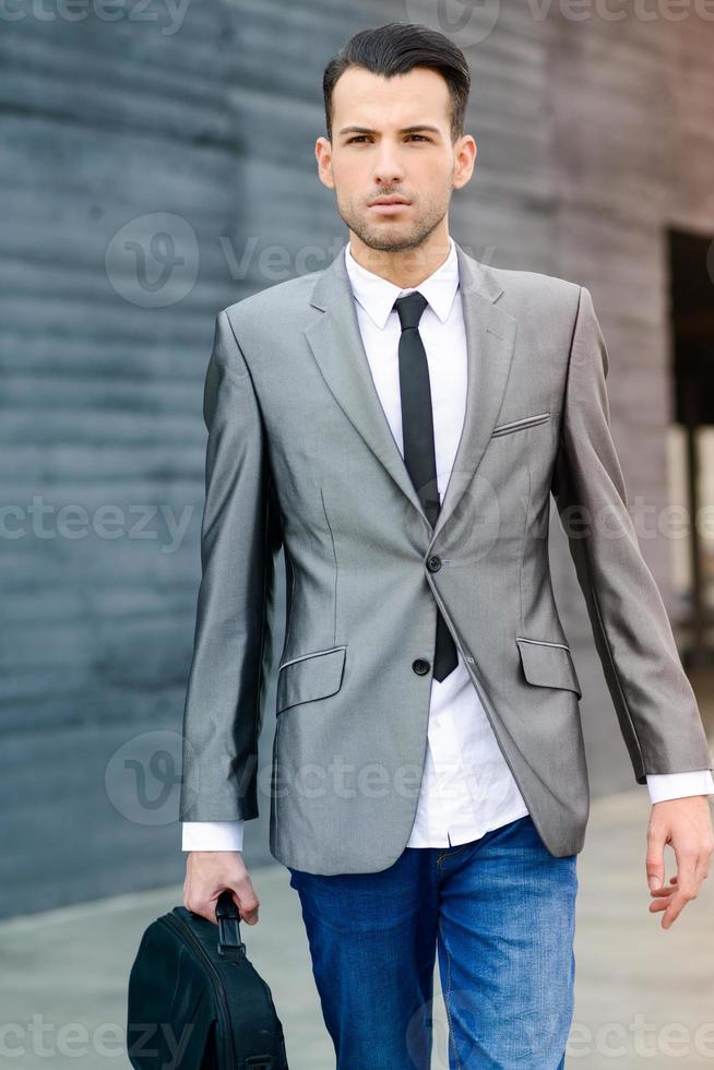 Young businessman near a office building photo