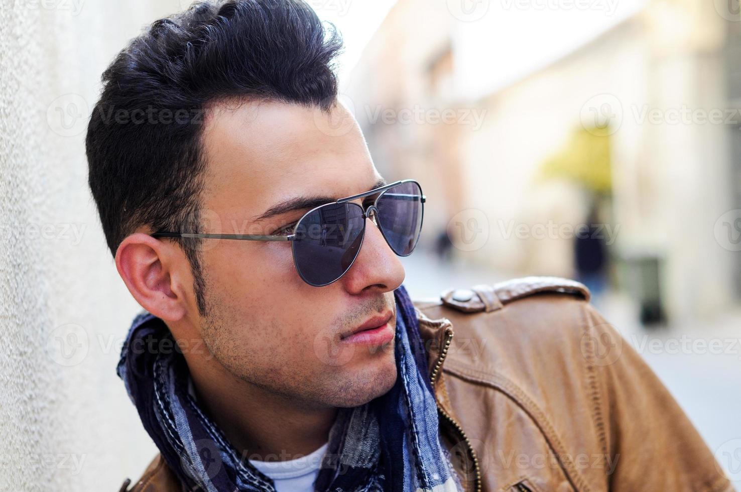 Attractive man with tinted sunglasses photo