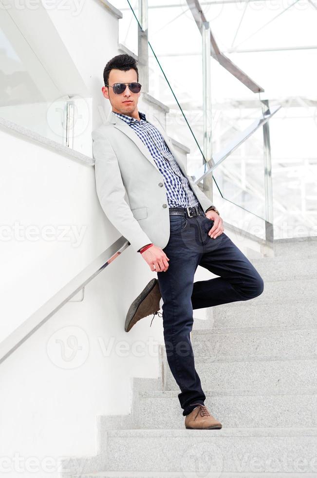 Attractive man with tinted sunglasses photo