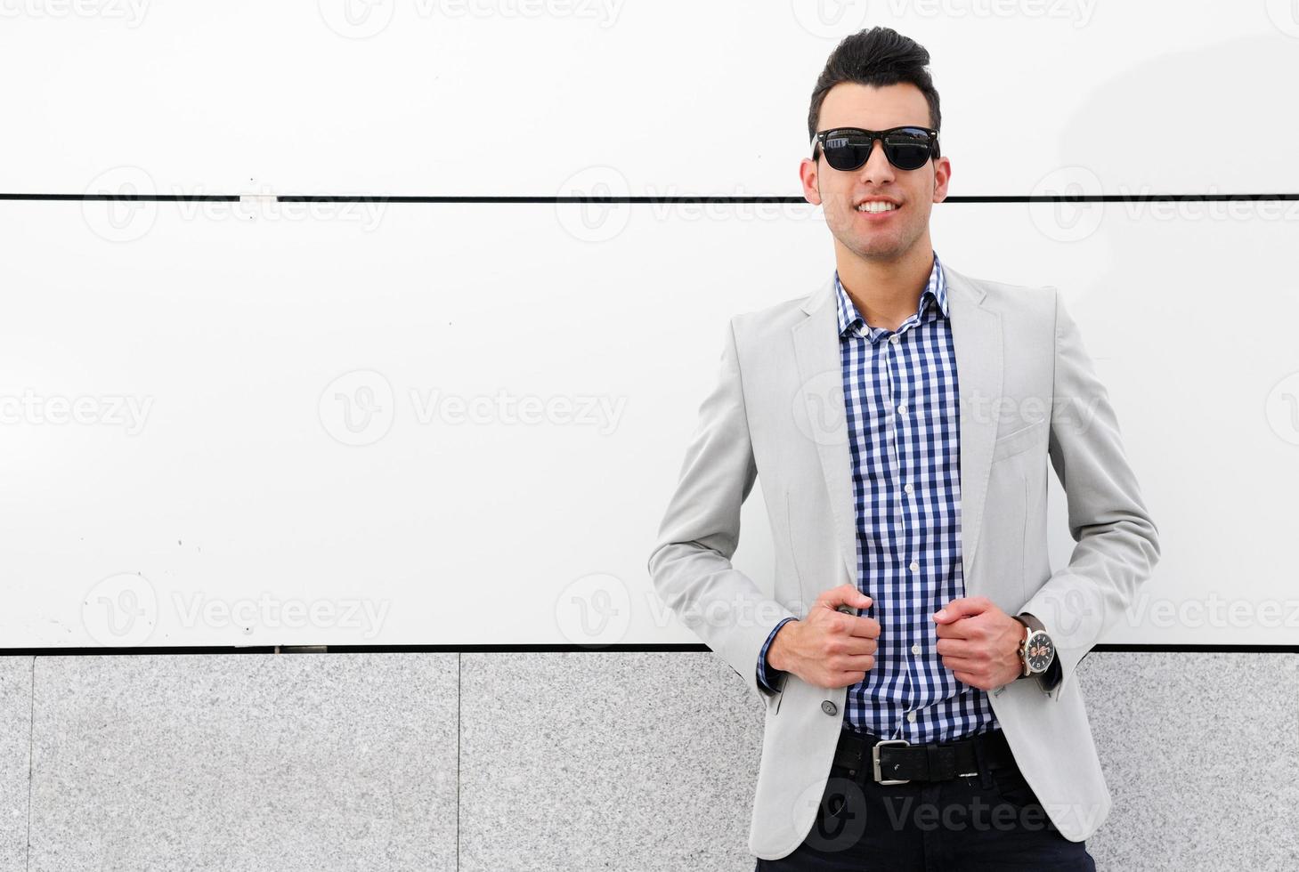 Attractive man with tinted sunglasses photo