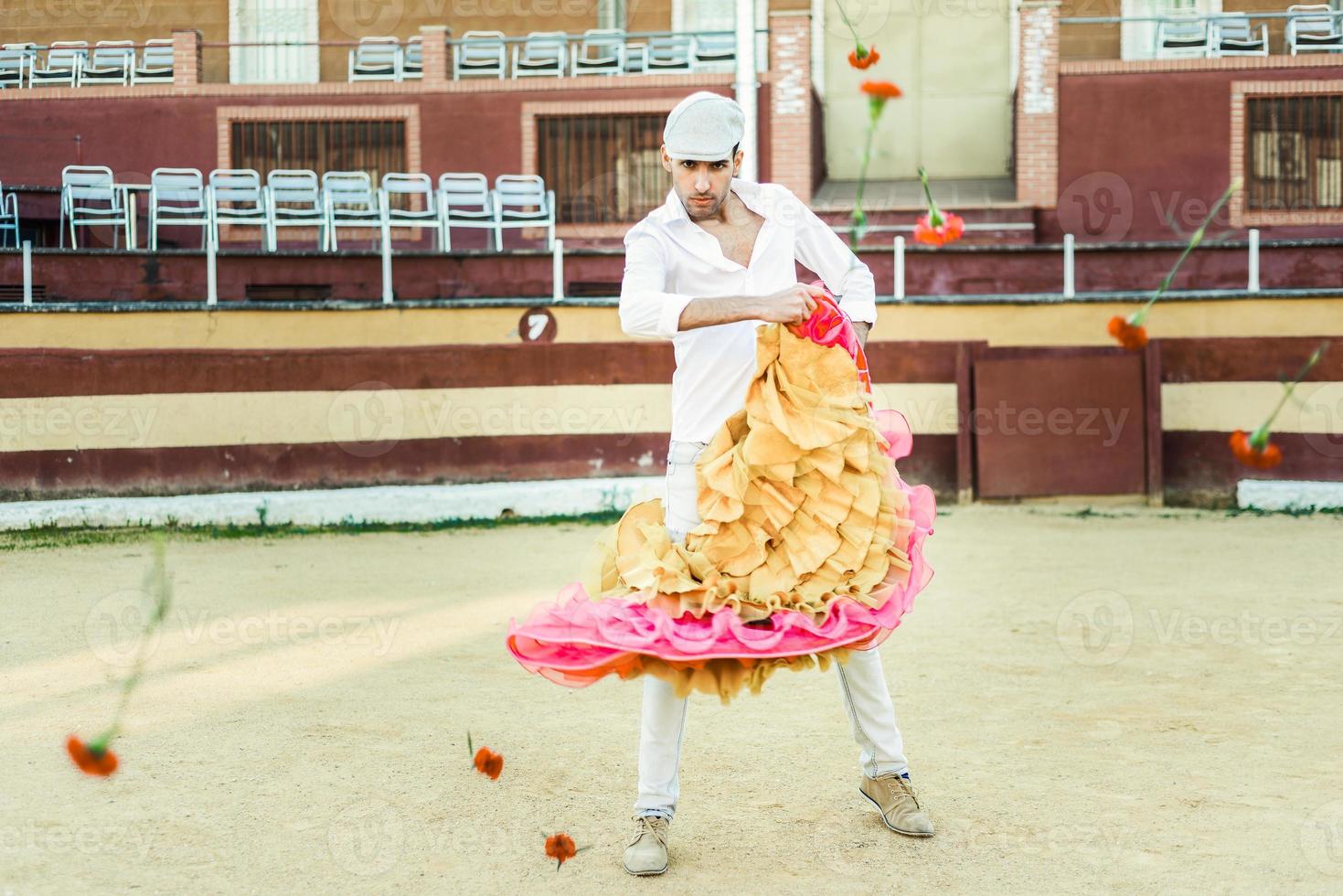Man, model of fashion, wearing spanish clothes in a bullring photo