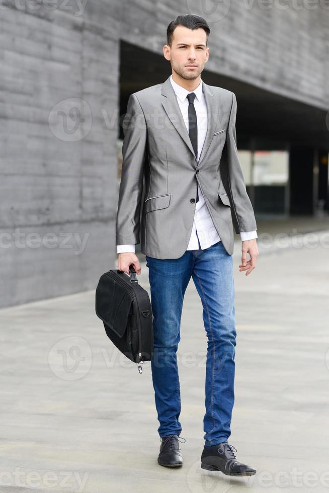 Young businessman near a office building photo