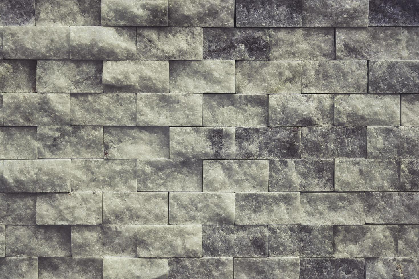 Adorno de textura realista de pared cuadrada de piedra gris abstracta construyendo roca en la naturaleza. foto