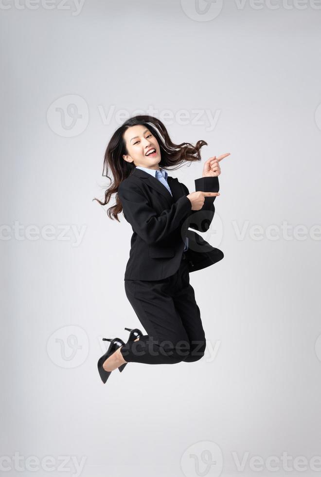 full body image of beautiful young asian businesswoman, isolated on white background photo