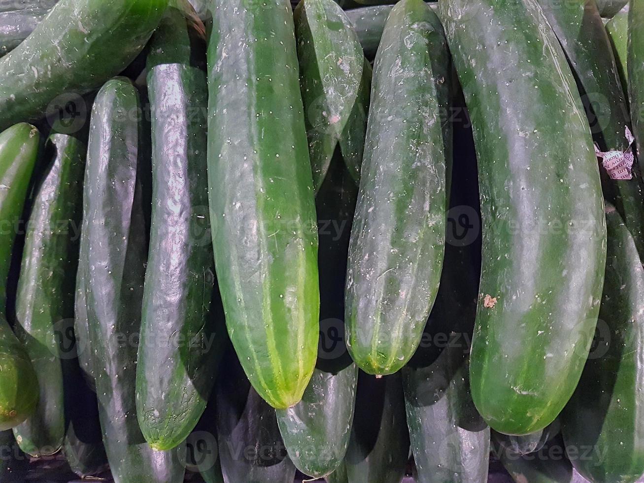 Cucumber vegetables in green are arranged neatly photo