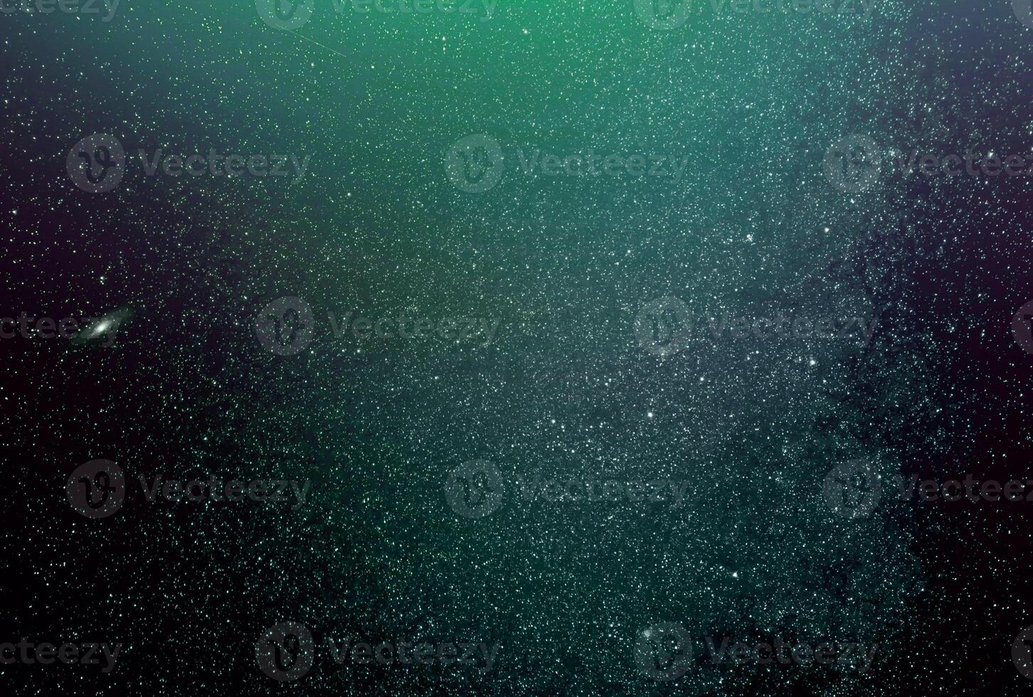 Fondo de galaxias abstractas con estrellas y planetas con motivo de galaxia verde del universo de luz nocturna foto