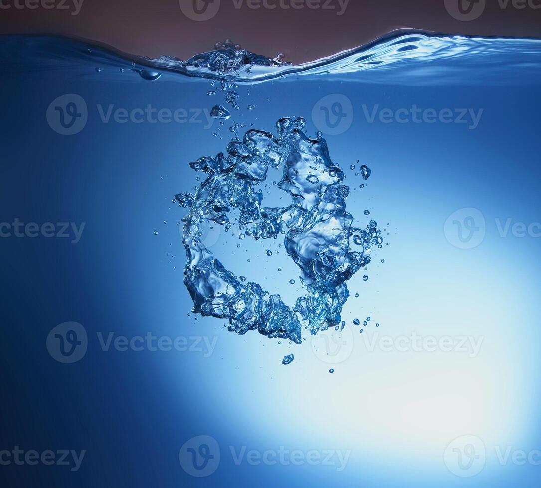 blue transparent water wave splash abstract with water bubbles on blue. photo