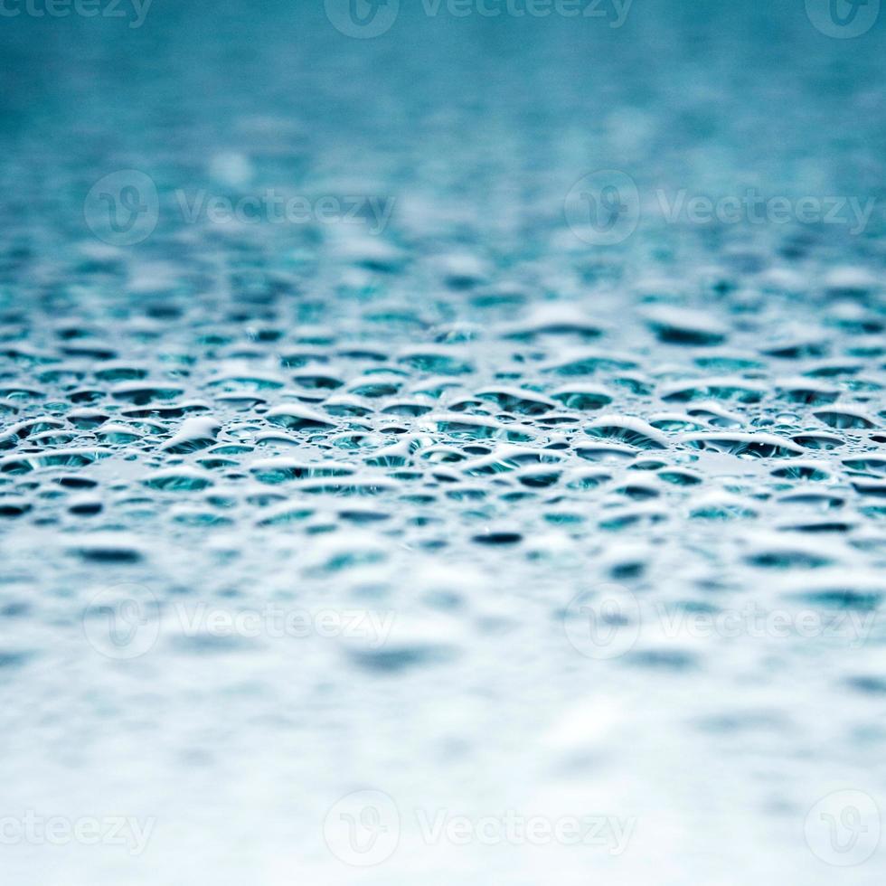light blue transparent water wave surface with splash bubble on water. photo